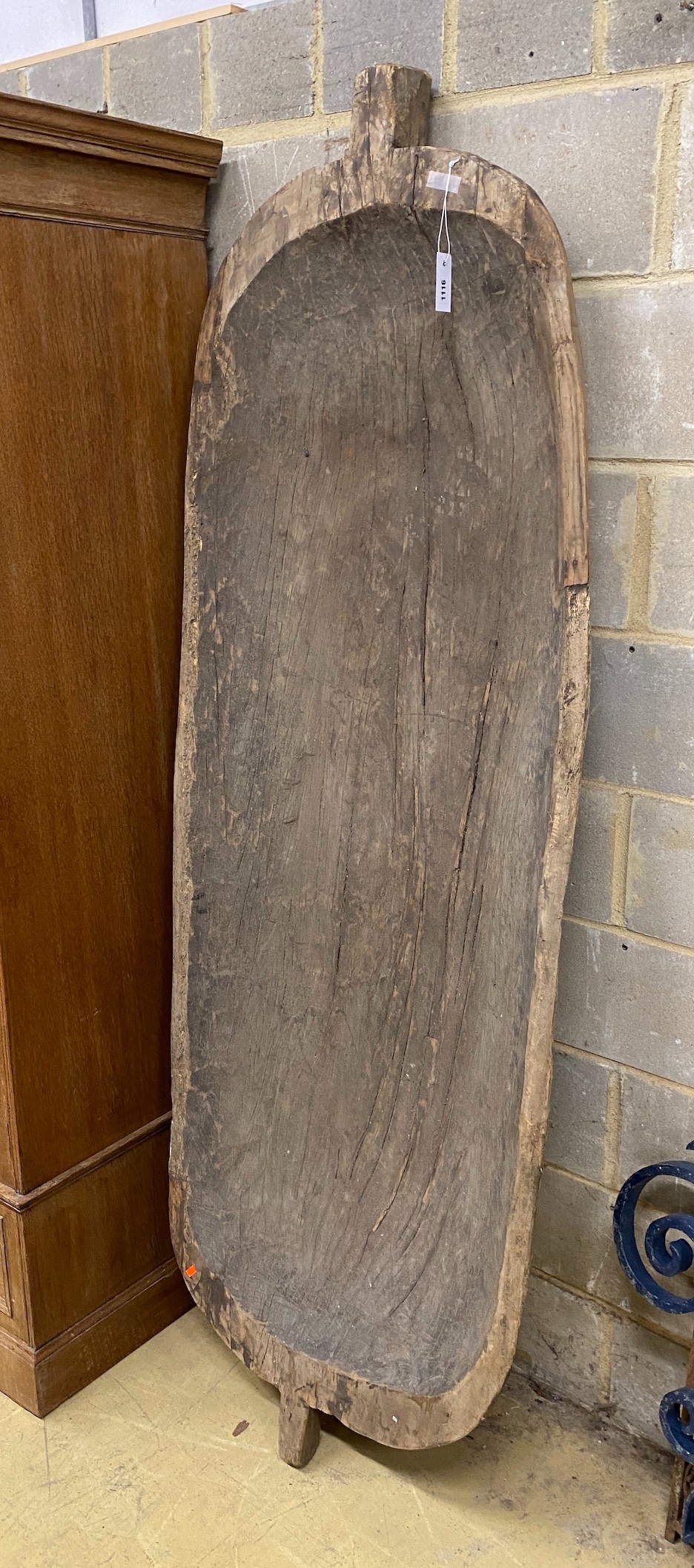 A large carved wood grain bin, width 75cm, height 210cm